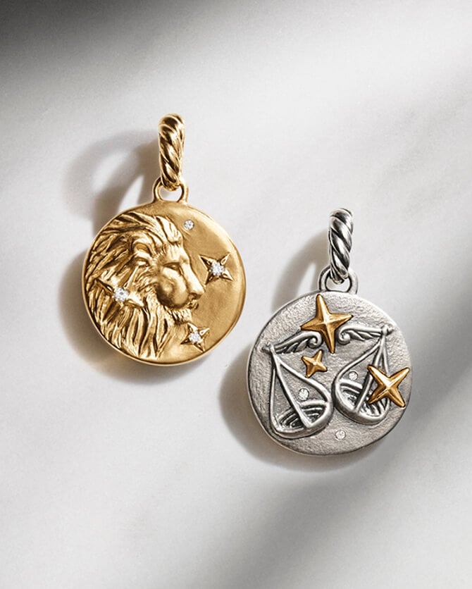 Two David Yurman zodiac amulets.