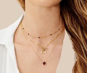 Model wearing David Yurman necklaces.