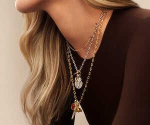 Model wearing David Yurman necklaces.