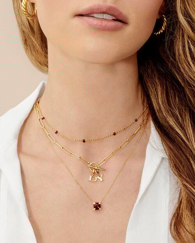 Model layering David Yurman necklaces.