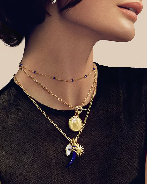 Female model wearing David Yurman necklaces and pendants.