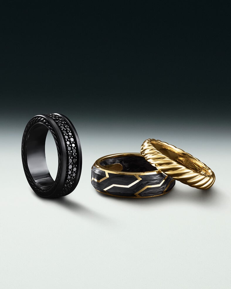 Three David Yurman men's rings.