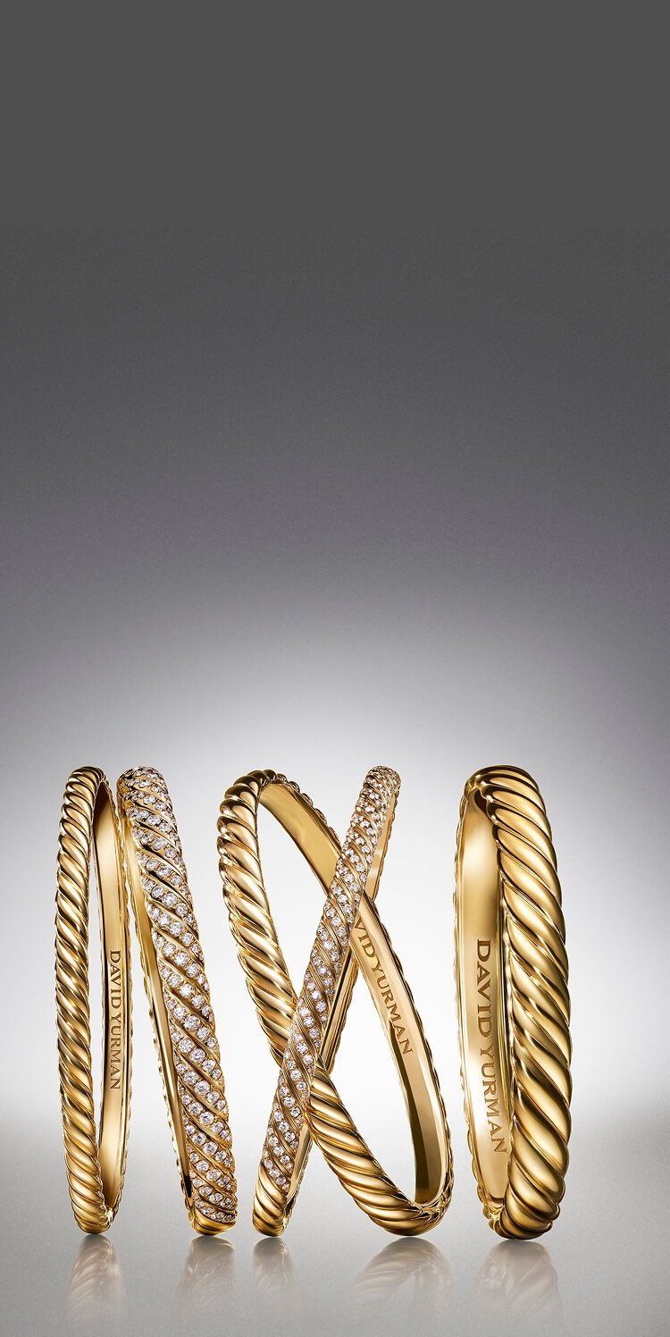 Five David Yurman Sculpted Cable bracelets.