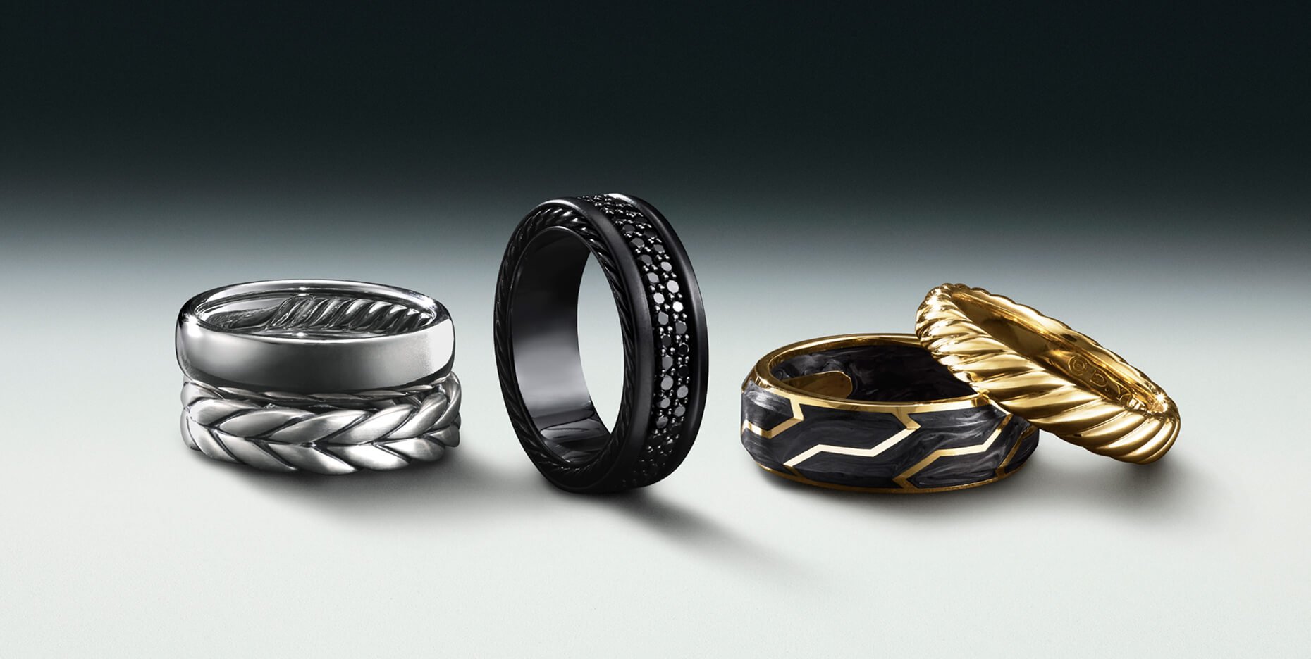 Three David Yurman men's rings.