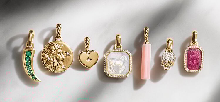 Seven David Yurman charms and amulets.